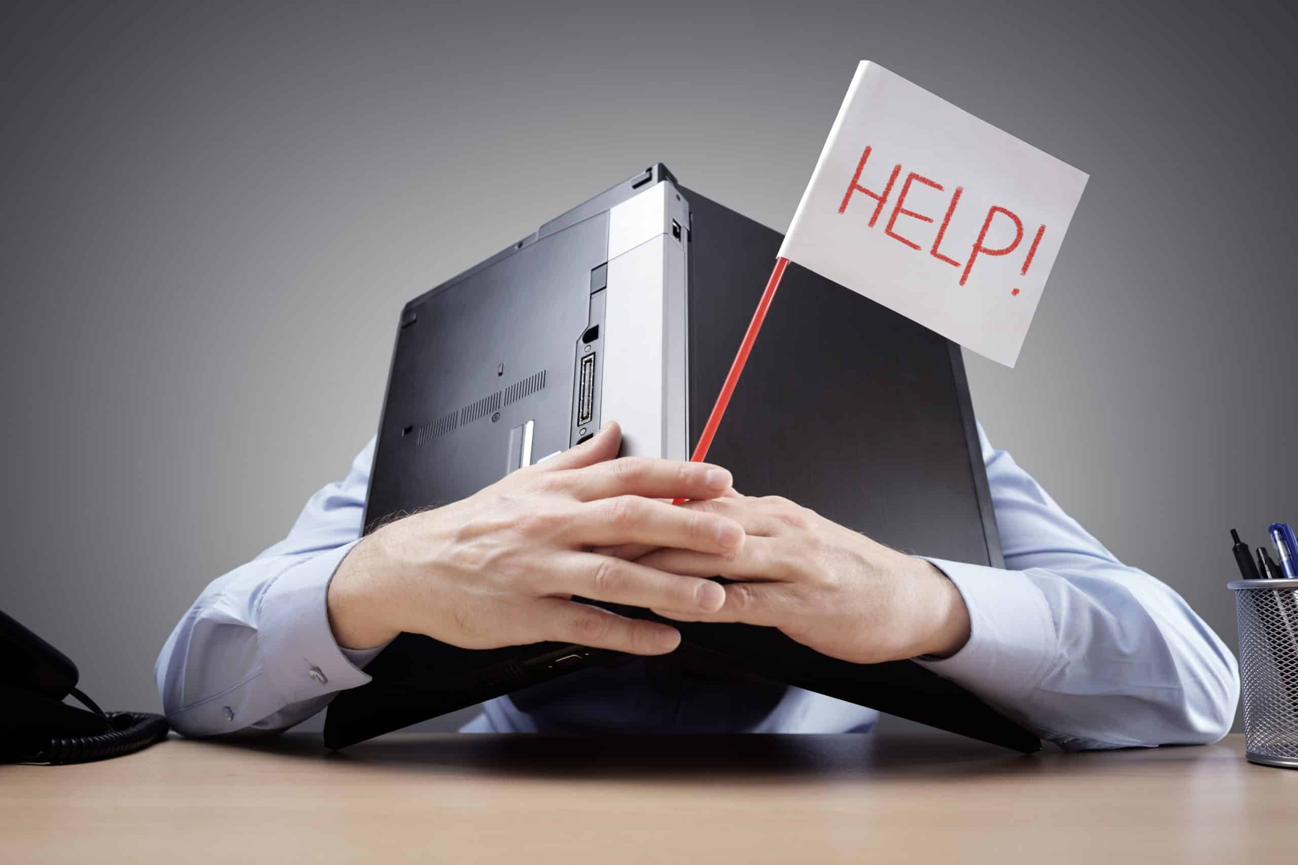 Businessman-burying-his-head-uner-a-laptop-asking-for-help