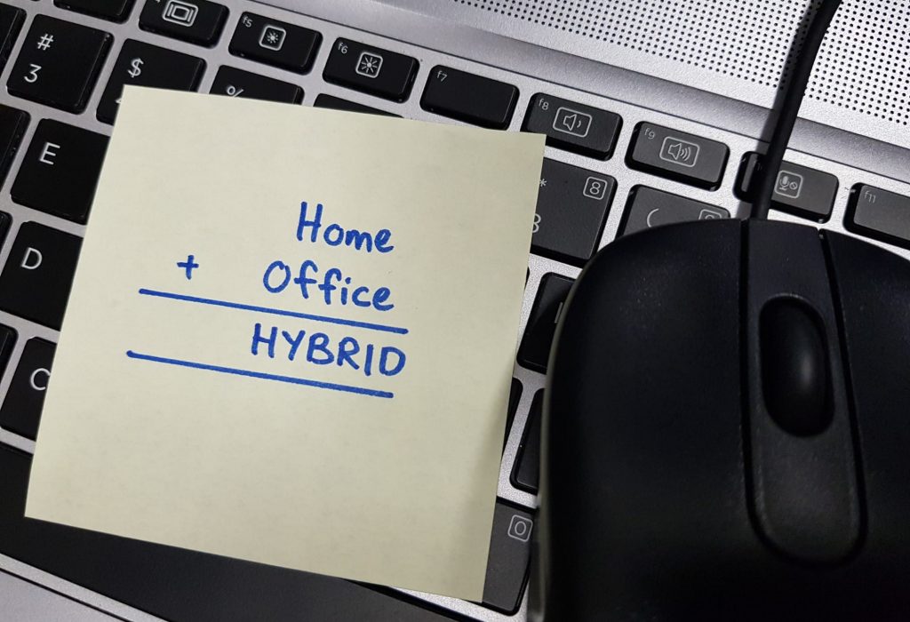 Hybrid-working-model-due-to-covid-19-pandemic.-Work-from-home-or-remote-or-in-office.-A-sticky-pad-with-the-words-Home,-Office-and-Hybrid-written-on-it-1340914534_4032x3024
