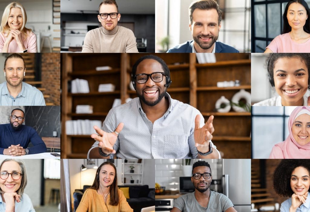 Confident African male business coach holding online webinar, a group of diverse people involved. Online video meeting of multinational work team, video call screen with a many people profiles on it