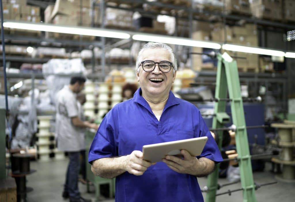Portrait of a happy employee using digital tablet